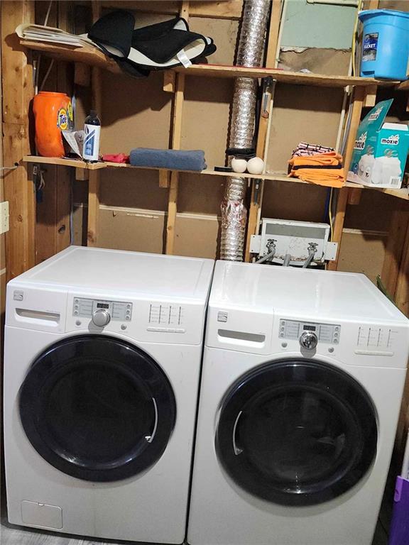 laundry area with independent washer and dryer