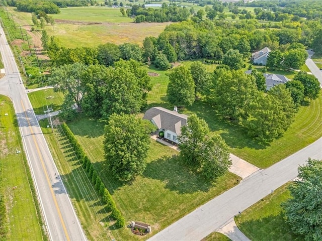 birds eye view of property with a rural view