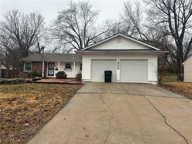 ranch-style home with a garage and concrete driveway