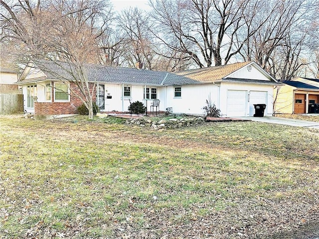 ranch-style home with a garage, driveway, a chimney, a front yard, and brick siding