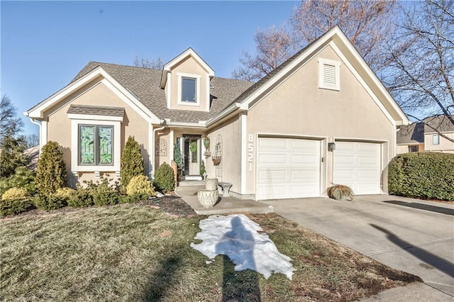 view of front of property featuring a garage and a front yard