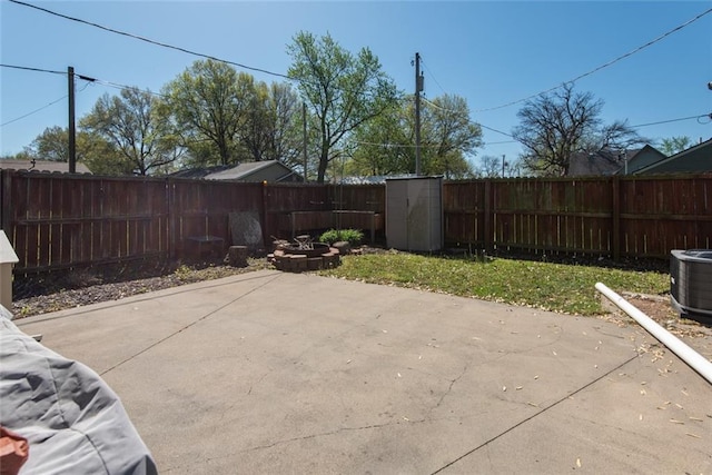 view of patio / terrace with cooling unit and a storage unit