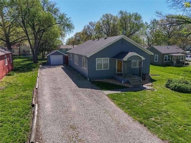 view of front of home with a garage, an outdoor structure, and a front lawn