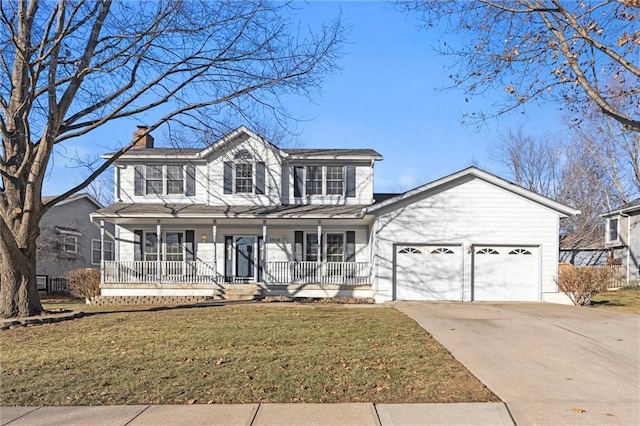 view of front of property with a porch, a garage, and a front yard