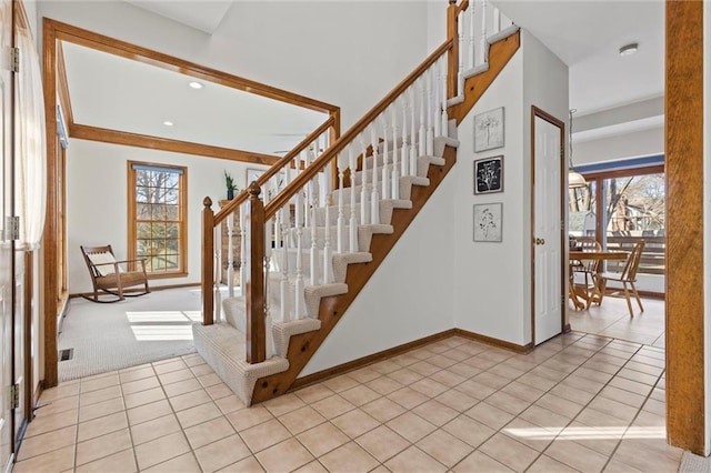 stairs featuring a healthy amount of sunlight and tile patterned flooring