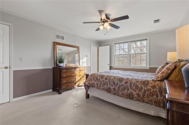 bedroom featuring crown molding, light colored carpet, and ceiling fan