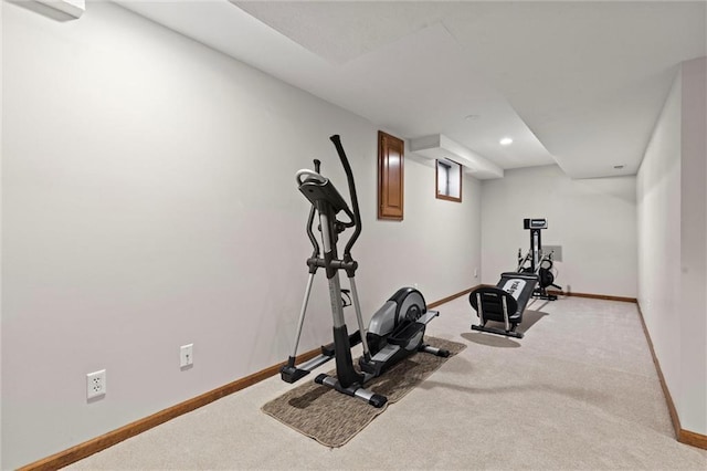 exercise area featuring light carpet