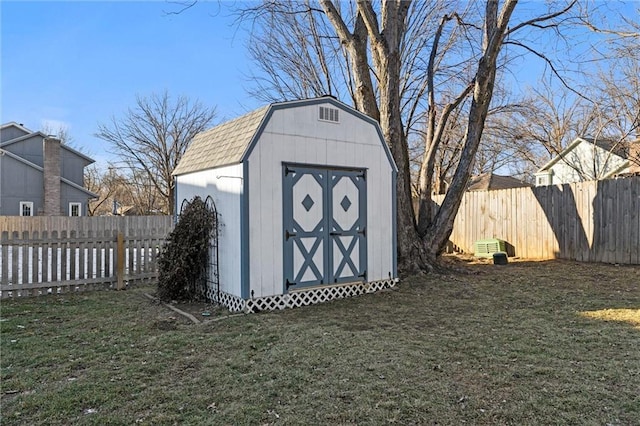 view of outbuilding featuring a lawn