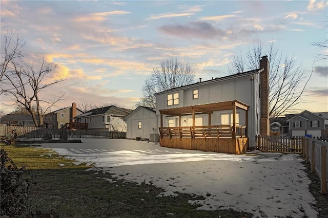 view of back house at dusk