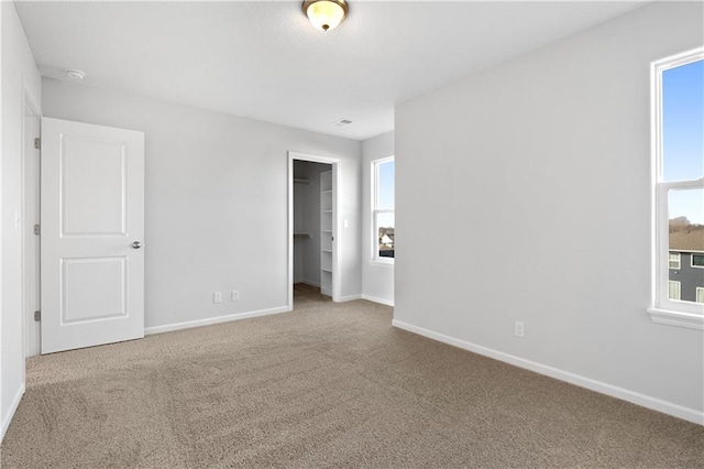 unfurnished room with carpet floors