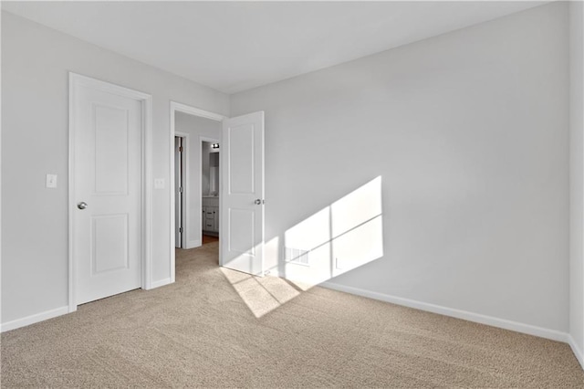 empty room with light colored carpet