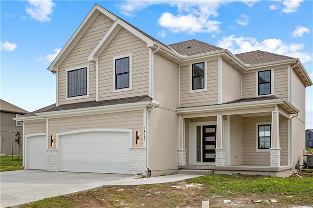 view of front of property featuring a garage and a porch