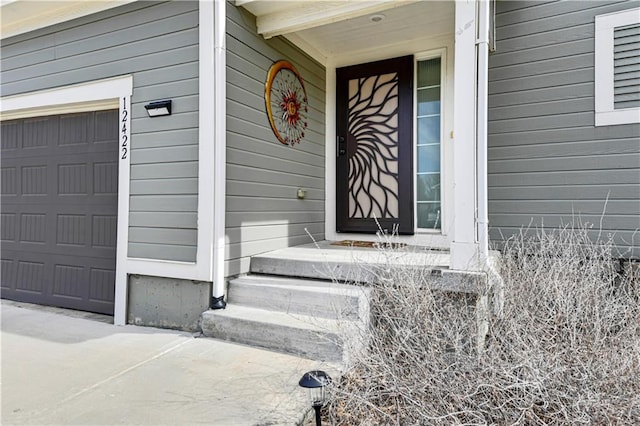 doorway to property featuring a garage