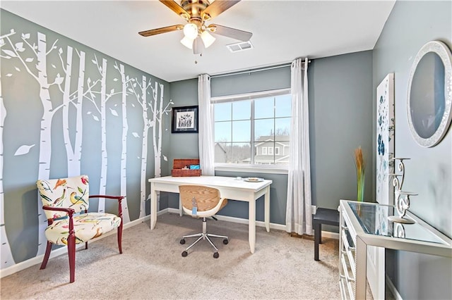 carpeted office featuring visible vents, ceiling fan, and baseboards