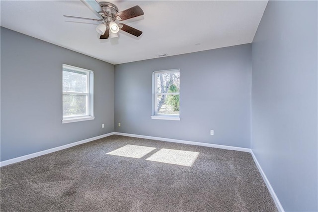 unfurnished room featuring ceiling fan and carpet