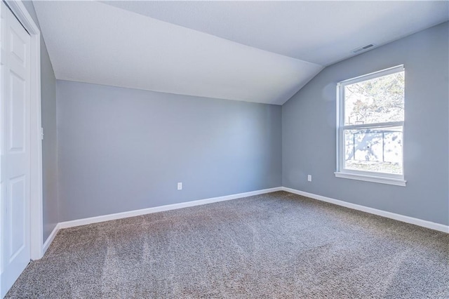 bonus room featuring lofted ceiling and carpet floors