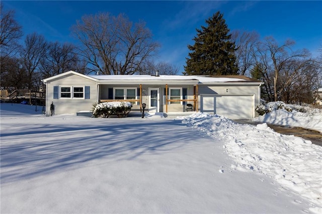 single story home featuring a garage and a porch