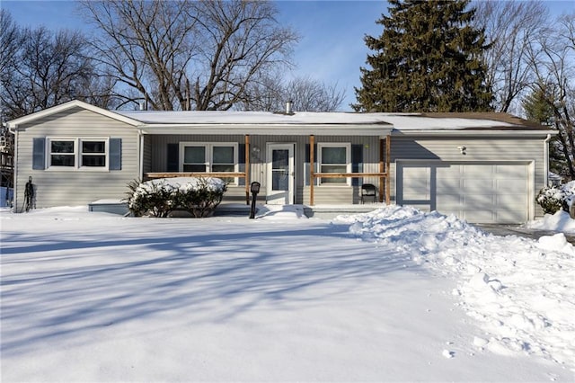 ranch-style house featuring a garage and covered porch