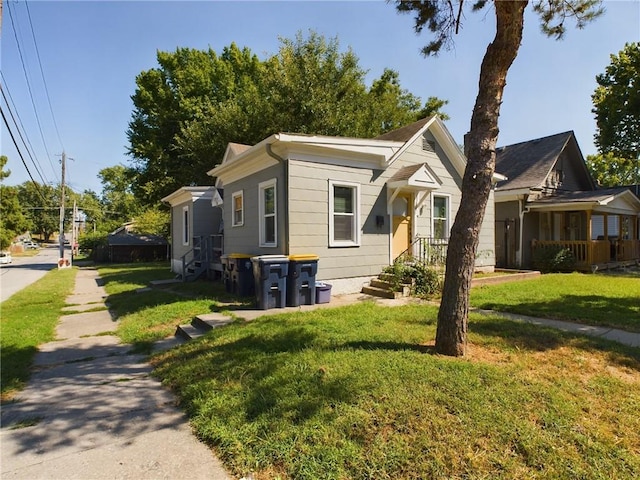 bungalow-style house with a front yard