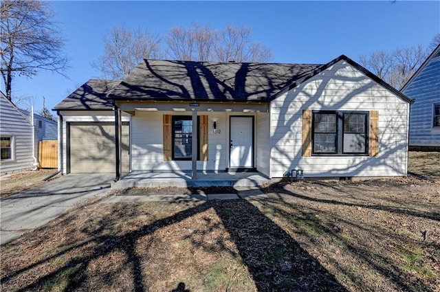 view of front of house featuring a porch and a garage