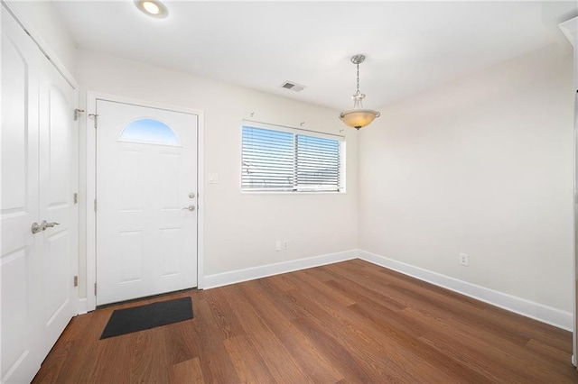 foyer entrance featuring dark wood-type flooring