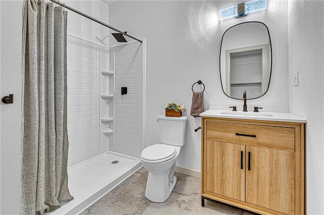 bathroom featuring vanity, curtained shower, and toilet