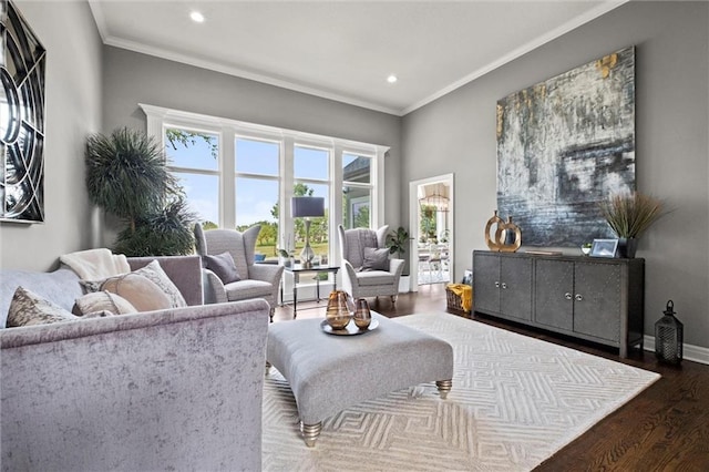 living room with hardwood / wood-style flooring and crown molding