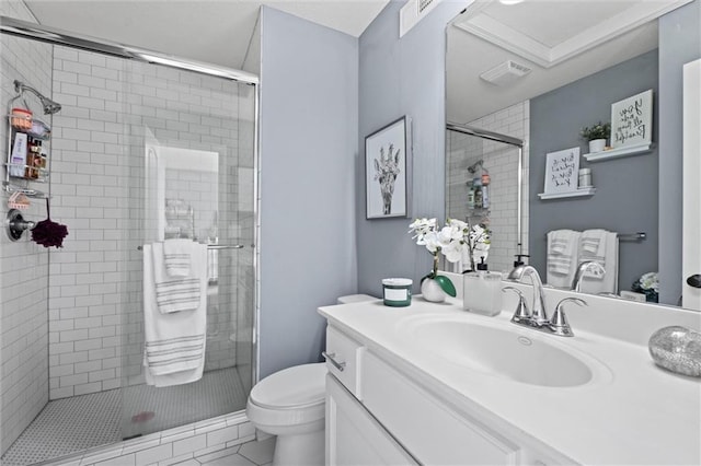 bathroom with vanity, tile patterned flooring, a shower with door, and toilet