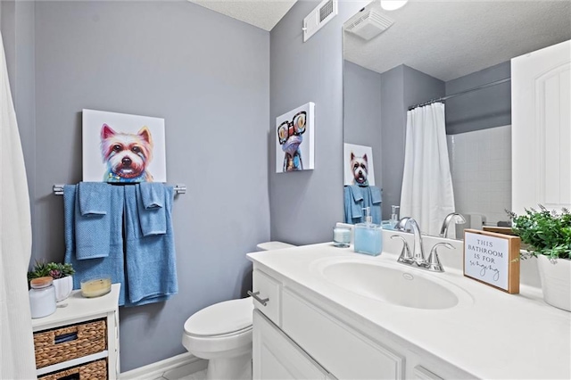 bathroom with vanity, a shower with curtain, and toilet