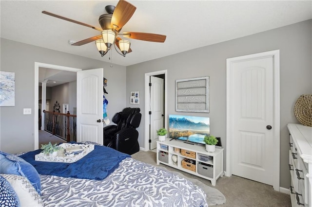 bedroom featuring light carpet, ceiling fan, and baseboards