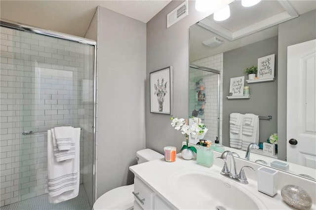 full bathroom with visible vents, toilet, a shower stall, and vanity