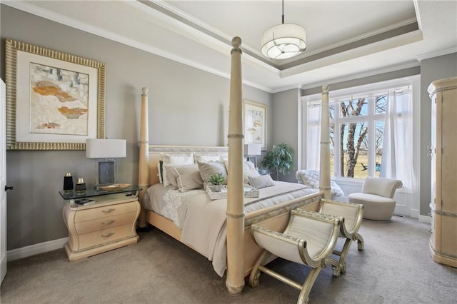 bedroom featuring light carpet, a tray ceiling, baseboards, and crown molding