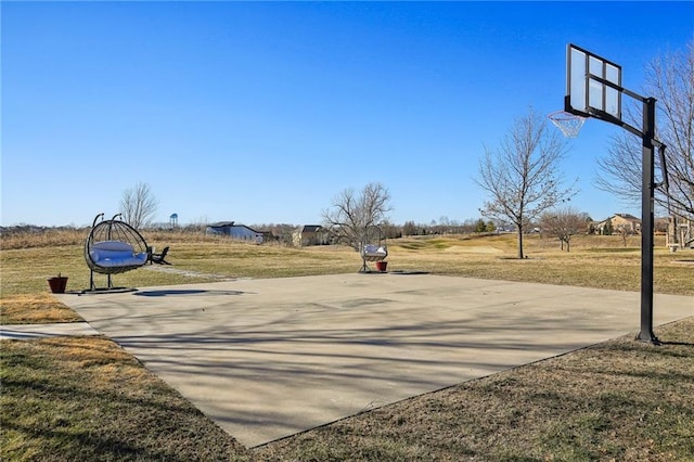 view of basketball court featuring community basketball court and a yard