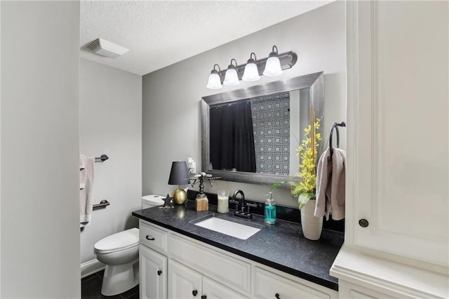 14110 Wingfoot Ct, Basehor, KS 66007 - bathroom with a textured ceiling, visible vents, toilet, and vanity