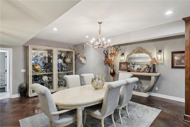14110 Wingfoot Ct, Basehor, KS 66007 - dining space with baseboards, an inviting chandelier, concrete flooring, and recessed lighting