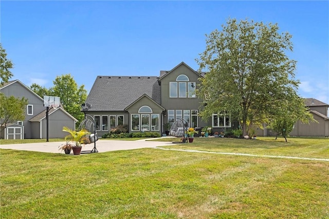 14110 Wingfoot Ct, Basehor, KS 66007 - view of front of property with a front lawn, a storage shed, and an outbuilding