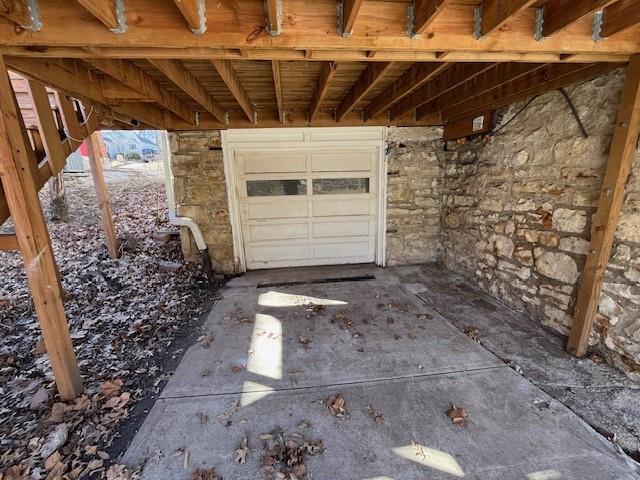 garage with concrete driveway