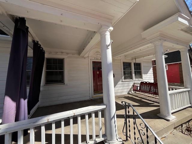 entrance to property with covered porch