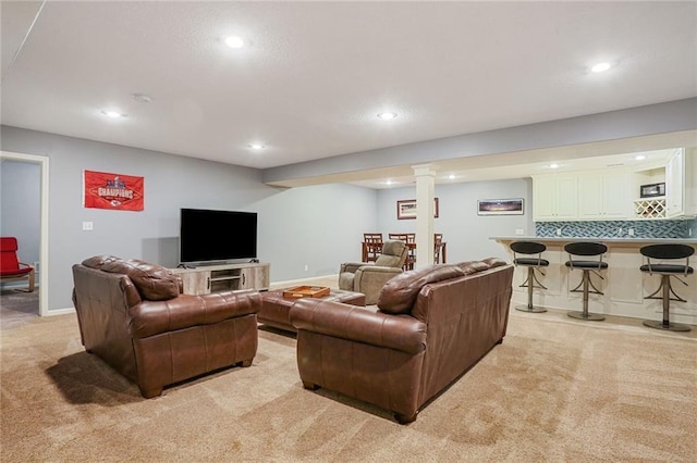 living room featuring recessed lighting, light colored carpet, and baseboards