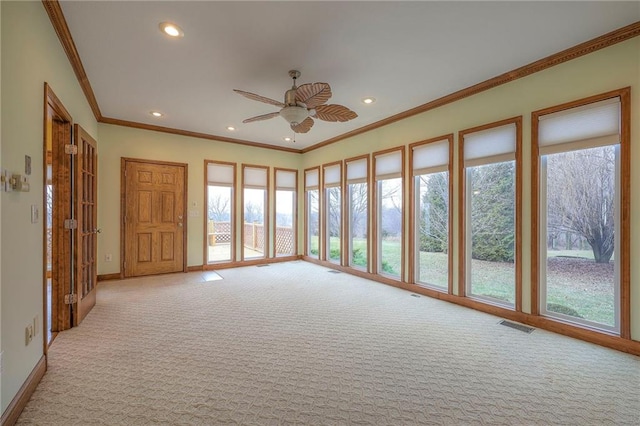 unfurnished sunroom with ceiling fan