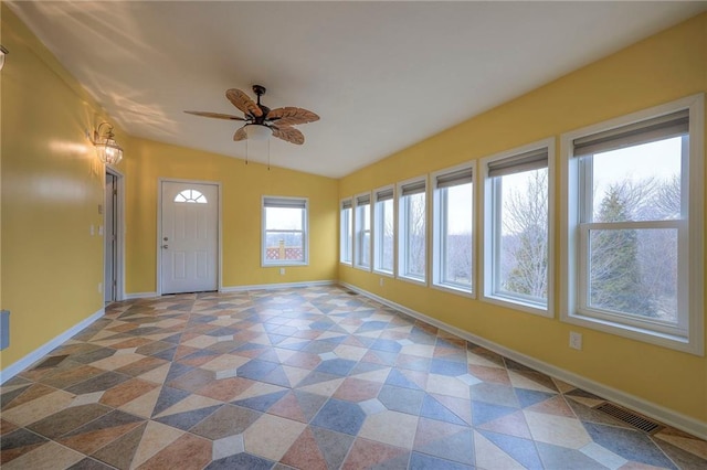 unfurnished sunroom featuring vaulted ceiling and ceiling fan