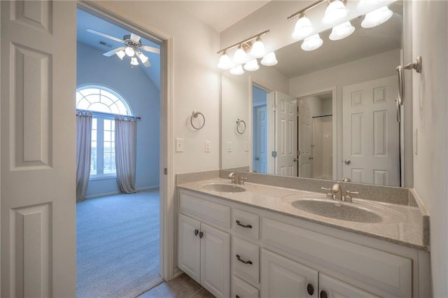 bathroom with vanity, lofted ceiling, and ceiling fan