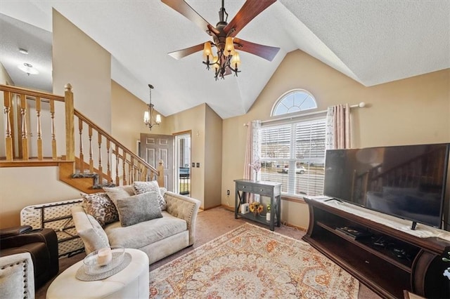 carpeted living room featuring ceiling fan, high vaulted ceiling, and a textured ceiling