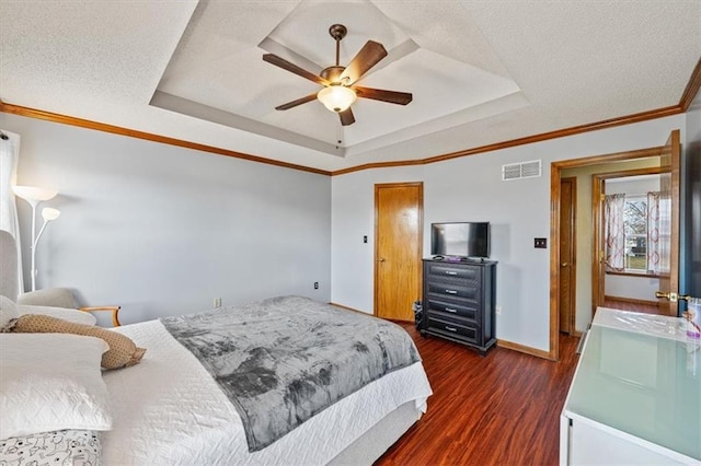 bedroom featuring crown molding, sink, a tray ceiling, and dark hardwood / wood-style floors