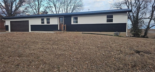 single story home with a garage