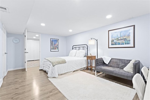 bedroom with wood-type flooring