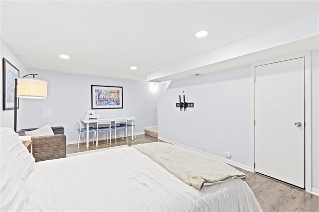 bedroom with light wood-type flooring