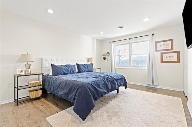 bedroom with light wood-type flooring