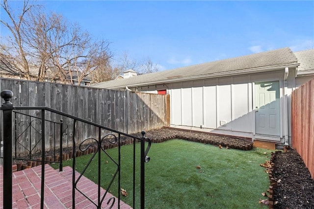 view of yard with a fenced backyard