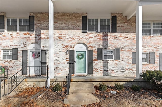 view of front of house featuring brick siding